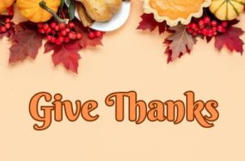 Photo of a Thanksgiving Day scene with the words "Give Thanks"